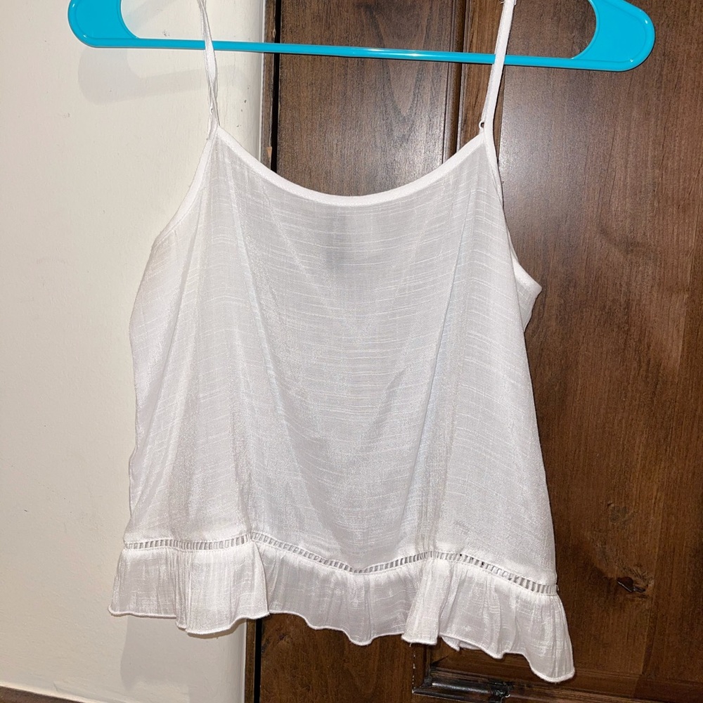 white tank w ruffle bottom